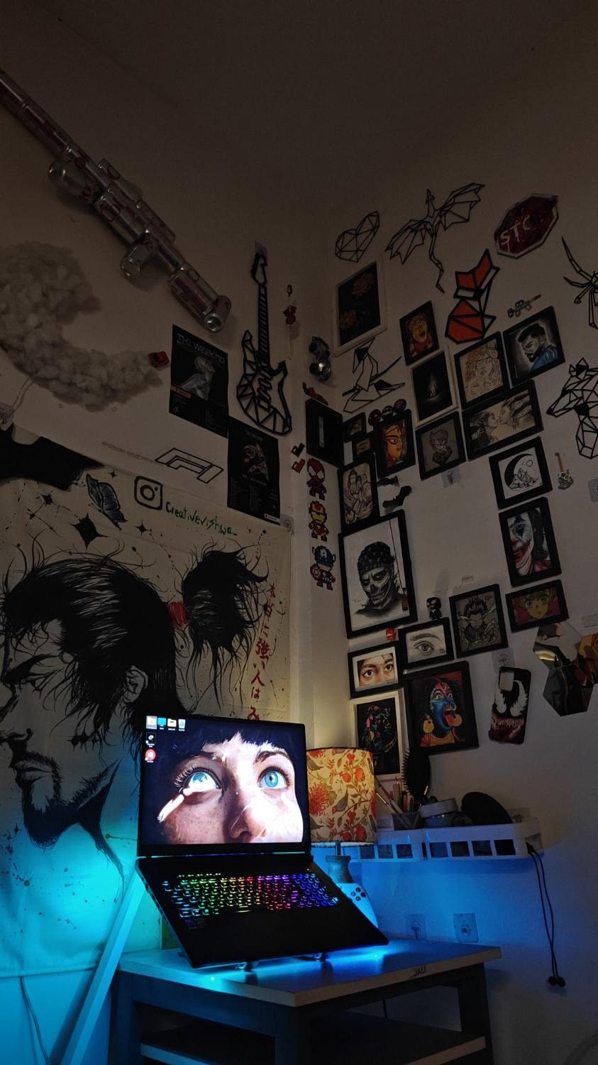 Studio corner with cool blue light from the desk